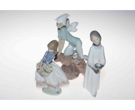 Three Lladro figures.