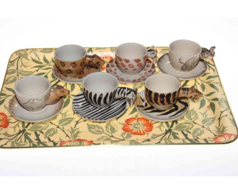 Set of six 'animal' styled cups and saucers.