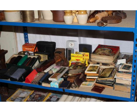 Shelf of collectables, spectacles, pictures, binoculars, camera, children's books, etc.