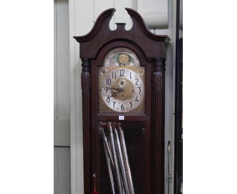 American triple weight longcase clock having arched moon phase dial.