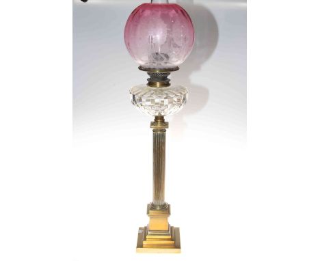 Victorian brass square reeded column oil lamp with a pink etched shade and a clear glass reservoir, 82cm.