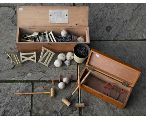 A boxed Army &amp; Navy Co-Operative Society clock golf set to/w a carpet croquet set - also boxed (2) 