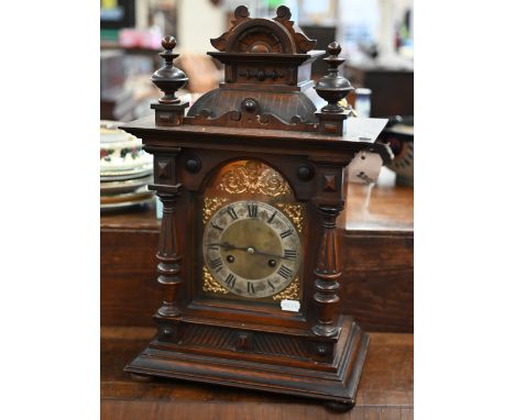 A German stained wood mantel clock, striking on two coiled gongs, 48 cm high 