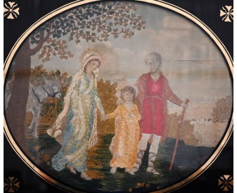A 19th century silk longstitch picture of The Holy Family, 36 x 42 cm in black glass slip and gilt frame 