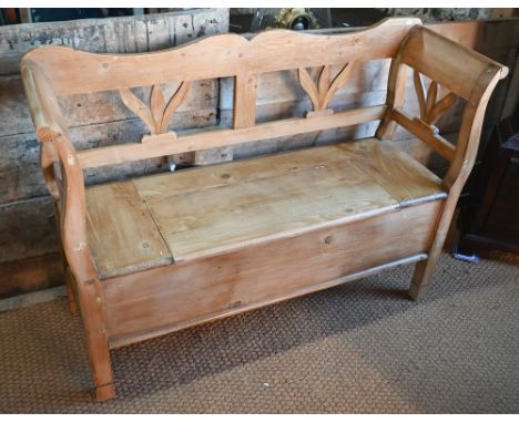 A Continental stropped pine box seated settle/hall bench, 127 cm w x 42 cm x 90 cm h 
