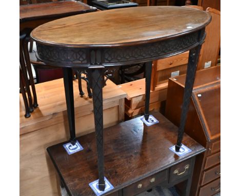 An Edwardian oval Chippendale style occasional table with blind fret decoration overall, 89 cm x 54 cm x 75 cm h 