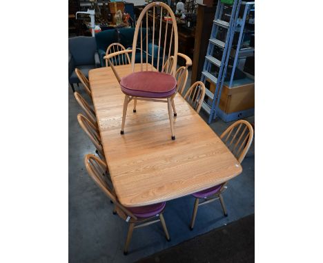 A modern Ercol Grand Windsor ash extending dining table with three optional central leaves (model 1158), 252 x 100 x 73 cm hi