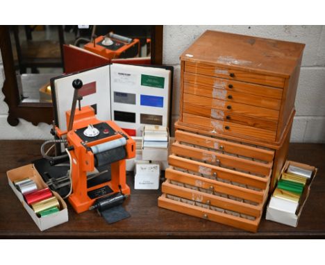 A Westwind Promotions Goldprint 235 card-embossing machine c/w two sets of drawers containing print-blocks, various card-blan