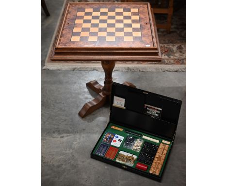 A walnut inlaid games table for chess, cards and backgammon 62 cm square to/w a boxed games compendium (2) 