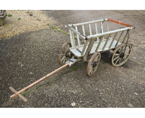A vintage wooden dog cart, with four steel banded wood spoke wheels, a/f 