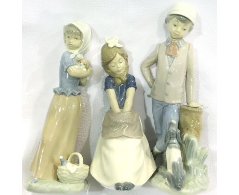 Three Nao child figurines, tallest H: 23 cm. No cracks, chips or visible restoration. P&amp;P Group 3 (£25+VAT for the first 