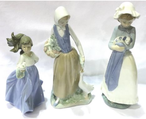 Three Nao girl figurines, largest H: 26 cm. No cracks, chips or visible restoration. P&amp;P Group 3 (£25+VAT for the first l