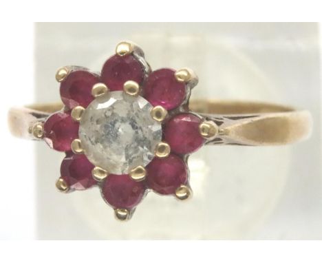 9ct gold topaz and ruby ring, size K/L, 1.8g. P&amp;P Group 1 (£14+VAT for the first lot and £1+VAT for subsequent lots) 