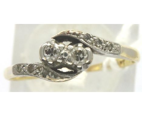 18ct gold diamond set twist ring, size N, 2.1g. P&amp;P Group 1 (£14+VAT for the first lot and £1+VAT for subsequent lots) 