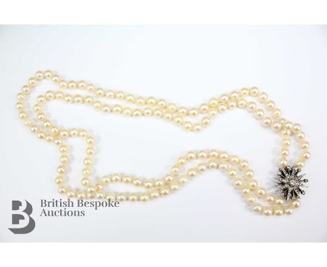 A set of double strand cultured pearl necklace, with silver star-burst clasp, London hallmark, dated 1968, mm LS Ltd, the pea
