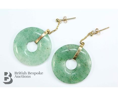 A pair of jade disc earrings, approx 31mm, on 9ct yellow gold fittings and butterfly.