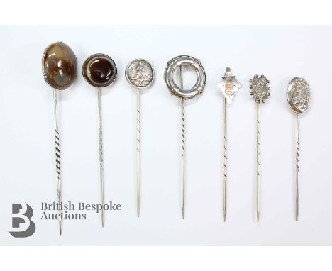 Silver-headed tie pins, including a 9ct gold and silver floral tie pin, life buoy, moss agate, soccer, banded agate and two f