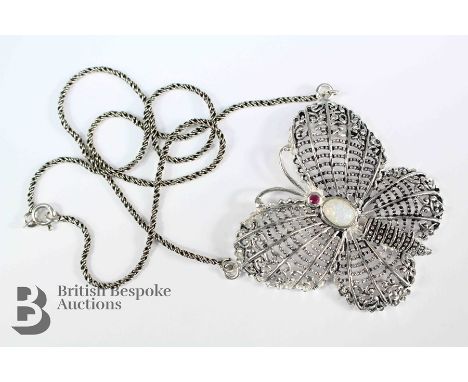 Silver filigree butterfly necklace, with opal body and ruby thorax, approx 45 x 47 mm, suspended on a fine chain, approx 40 c