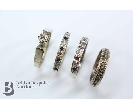 Four 9ct gold rings. This lot includes a sapphire and diamond ring size P, ruby and diamond size P, white stone full eternity