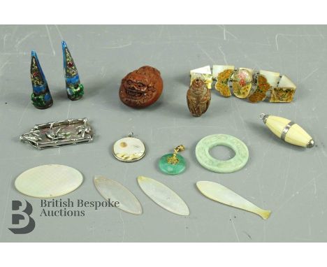Miscellaneous Oriental items, including jade amulet, sandalwood netsuke, nut buddha, jade pendant, bone pendant, mother-of-pe
