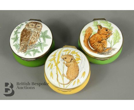 Three Crumless enamel circular boxes, illustrated with a squirrel, owl and field mouse. (3)