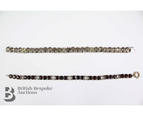 Silver and oval garnet bracelet, set with approx 24 garnets approx 5.5mm approx 18 cms length together with a white metal and