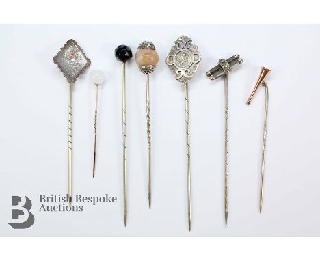 Miscellaneous silver headed tie pins, including 9ct gold hunting horn, floral, quartz and a beaded bar pin and two others. (7