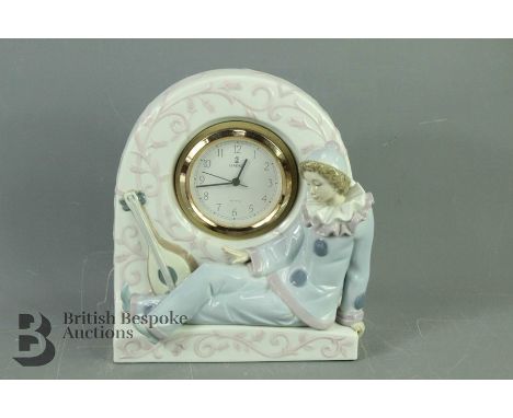 Lladro Pierrot Minstrel Mantel Clock, white enamel face with numeric dial, in working order at time of cataloguing, approx 19