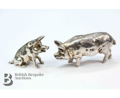 Two silver pigs, both London hallmark, the first depicted standing approx 50 x 20mm, approx 27.72 gms and the second smaller 