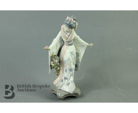Lladro Figurine - Geisha clasping a rose, approx 28 cms, blue factory marks to base.