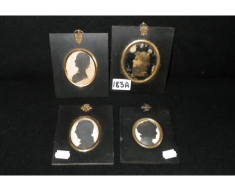 Four 19th century silhouette portrait miniatures, one with gilt highlights