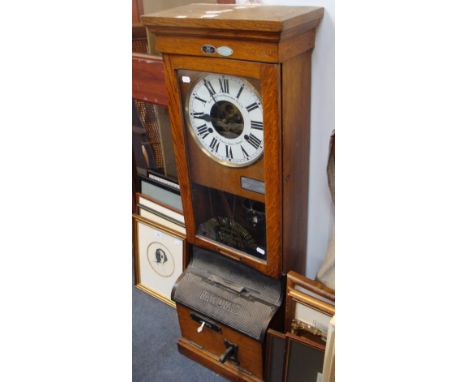 A National Time Recorder in an oak case