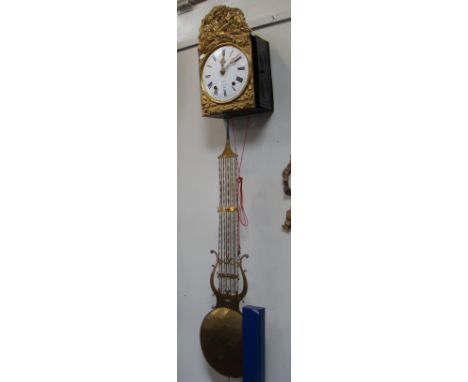 A 19th century French comptoise wall clock with enamel dial and embossed brass surround
