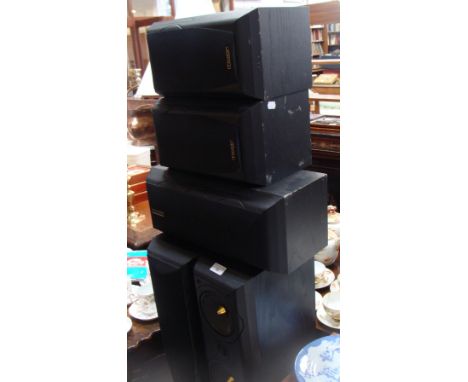 A pair of Mission black ash-cased speakers (77Series), three smaller Mission speakers and a Yamaha DSP-A5 amplifier
