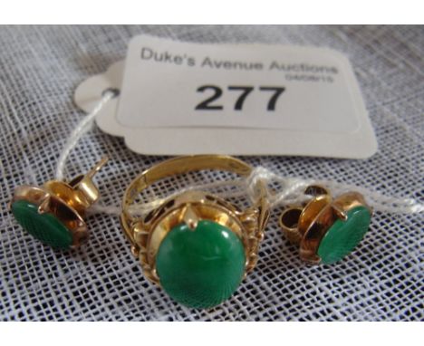 A dyed green 'jade' cabochon ring and a pair of earstuds ensuite, in unmarked yellow metal