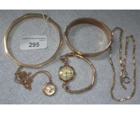 A 9ct yellow gold slave bangle, a 14ct yellow gold fancy link chain and other gold and gold coloured items
