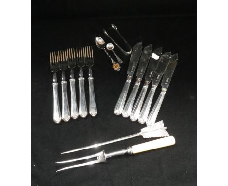 A set of five silver handled and bladed fish knives and associated white metal forks and other flatware items including sugar