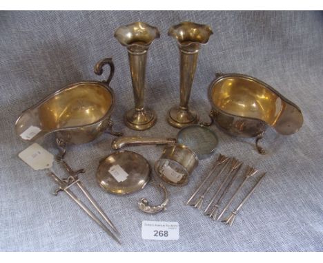 A pair of silver Birmingham sauce boats, with shell pad feet, a pair of loaded silver posy vases and other silver and white m