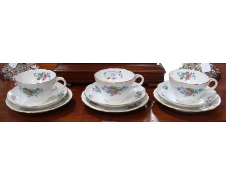 Three Spode Copeland china cups, saucers and plates of large proportions, decorated with floral sprays