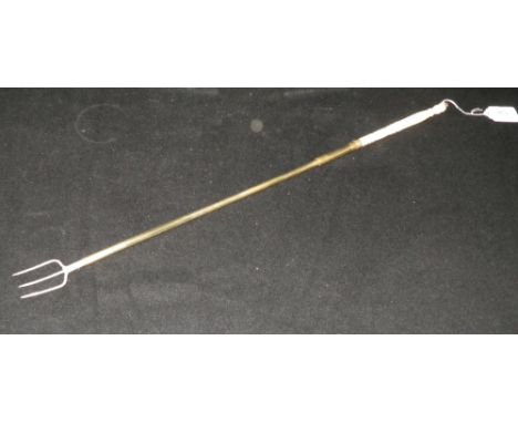 A long handled toasting fork with ivory terminal