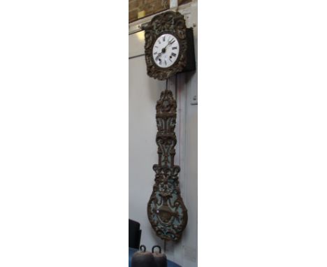 A 19th century Comptoise wall clock with enamel dial and embossed face and large pendulum 