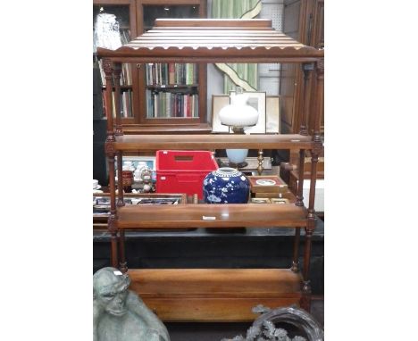 A reproduction mahogany open shelf, of architectural design on turned columns and single drawer below