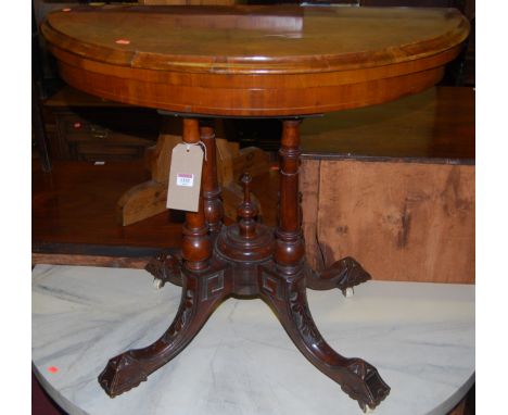 A mid-Victorian figured walnut demi-lune baize lined fold-over card table, having a revolving action, width 89cm