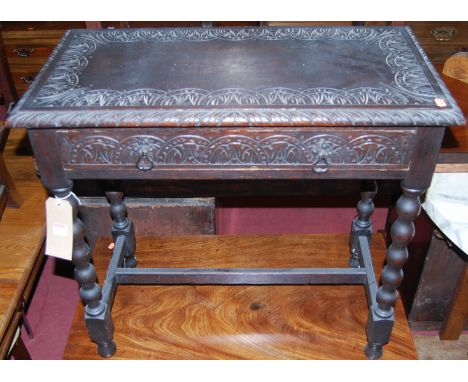 A circa 1900 ebonised and line carved oak single drawer side table, raised on bobbin turned supports, width 76.5cm