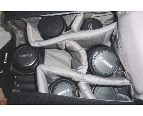 Canon EOS 550D camera, EFS 18-55mm lens, 70-300mm lens, macro lens EF-5 60mm, 50mm, 28mm lens in backpack carry case with bat