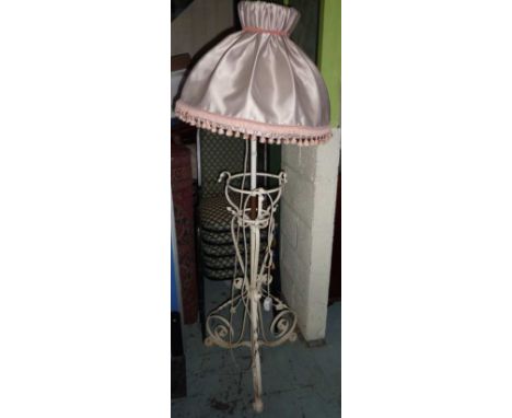Wrought metal adjustable height lamp