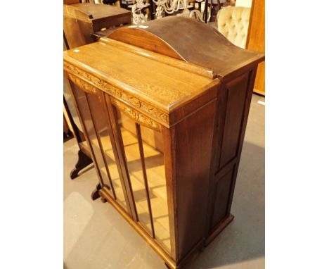 Two display cabinets with a domed topped three shelf bookcase