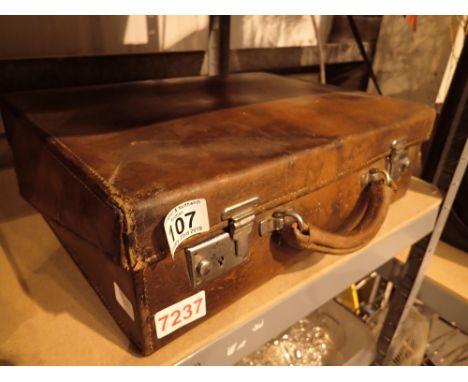 Vintage leather briefcase with document folder interior 