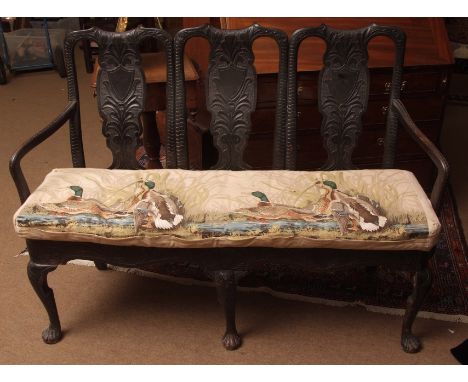 Early 19th century ebonised triple chair back sofa with central shield and foliate moulded splat backs, splayed moulded arms 