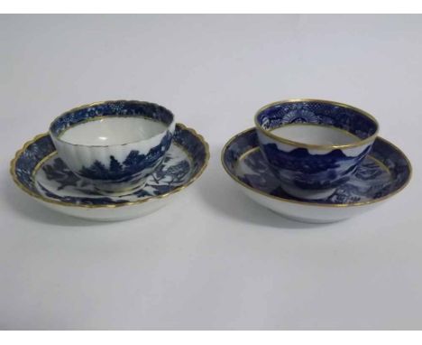 Two late 18th century English tea bowls and saucers, printed in blue with gilded detail (2)  